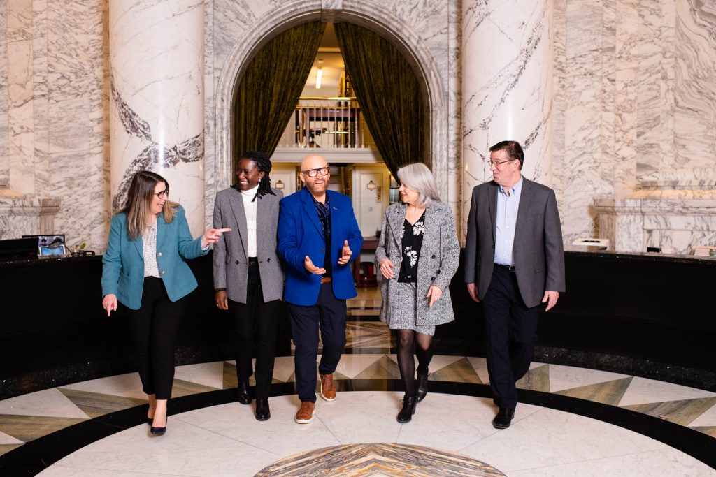 OAG exec walking in library