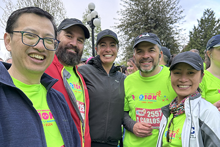 Staff wearing lime green running shirts for the TC 10k race