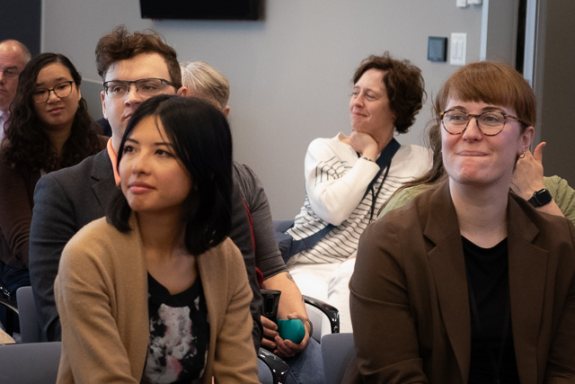 Auditors listen attentively during a training session