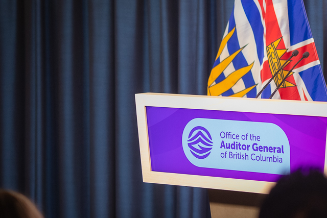 Podium with office's logo in the legislative press theatre