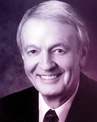 Portrait of an older man, short white hair, in a suit and tie. Name: Errol Price.