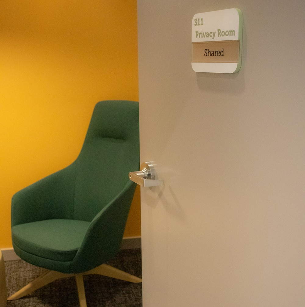 Entrance to a privacy room with a cozy armchair inside.