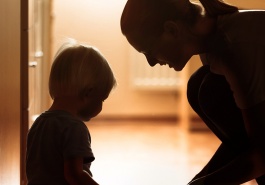Report cover image showing a mother and child in silhouette